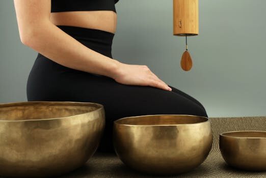 A tranquil scene featuring meditation with Tibetan singing bowls for relaxation and healing.
